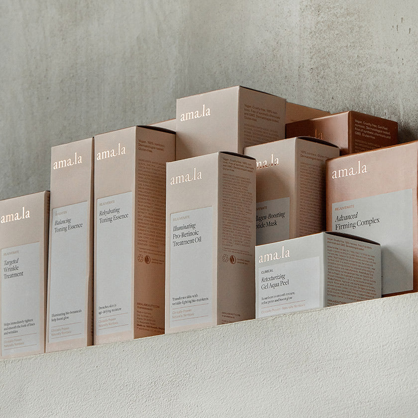 Amala products and boxes on textured surface